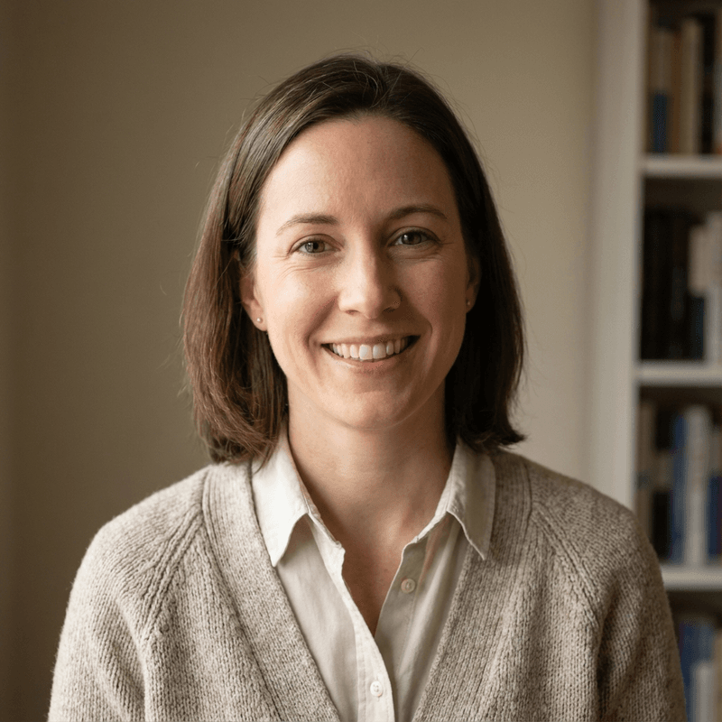 A smiling educator in a home study